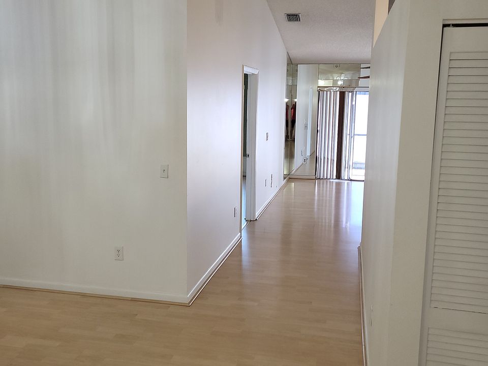 looking down to living room and dining room to the left