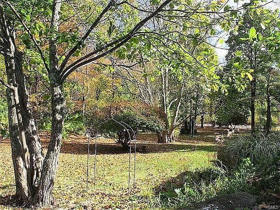 Century old trees and specimen plantings adorn the property.