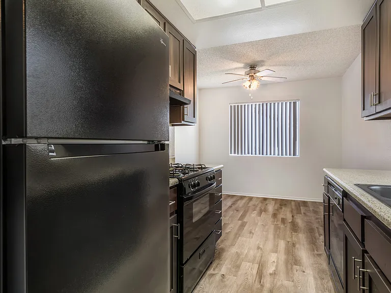 Sedona Apartments in Moreno Valley offers renovated units with updated flooring, sleek black appliances, modern cabinets, and stylish ceiling fans.
