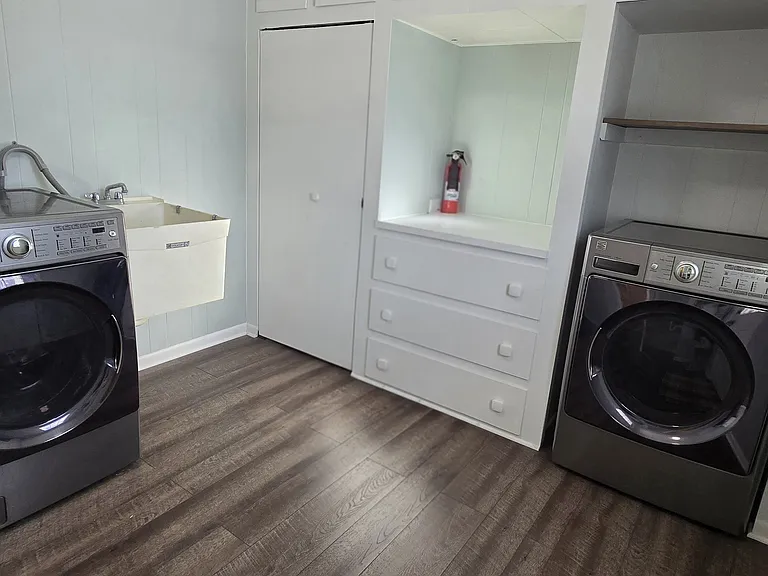 laundry / mud room with closet and storage