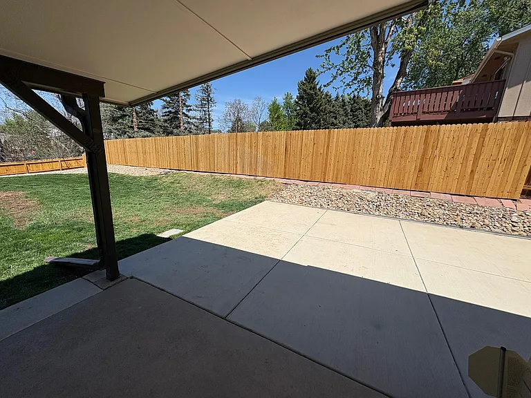 covered back patio, large fully fenced backyard (lawncare included in rent)