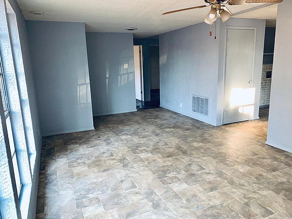 Living room facing hallway. Kitchen & Laundry on the right.