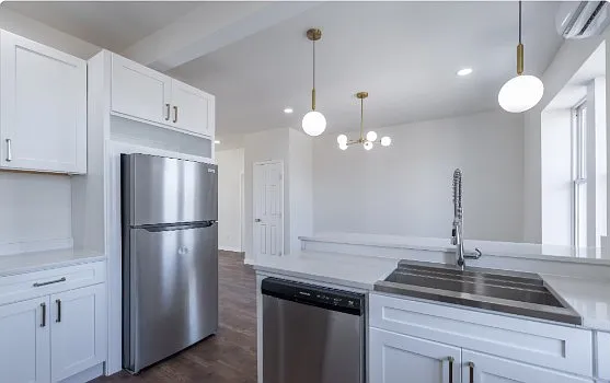 Fully renovated and move-in ready! Enjoy a beautiful open kitchen with stainless steel appliances, quartz countertops, modern fixtures, ample cabinet space, and a breakfast bar overlooking the living area.