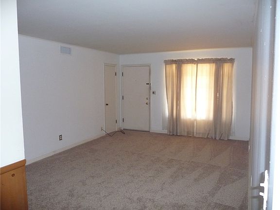 LIVING ROOM LOOKING AT FRONT DOOR