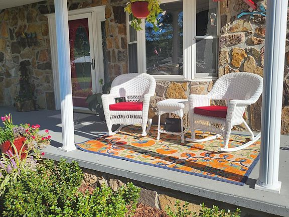 Enjoy bird watching on the rocking chair covered front porch