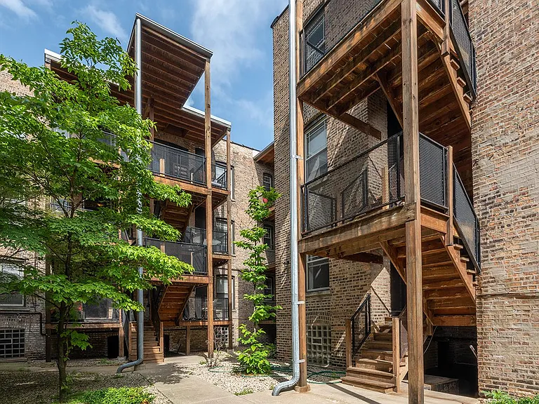 The quiet, Zen Serenity Gardens Courtyard with peaceful-inspired landscaping. Relax on your large, convenient balcony for extended outdoor living.