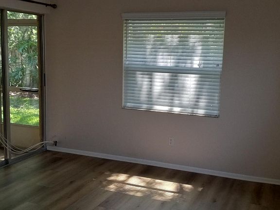 Masterbedroom with slider to back porch.