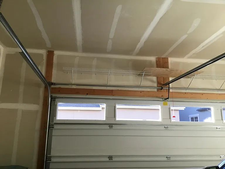 Extra storage above garage rollup door for lightweight items