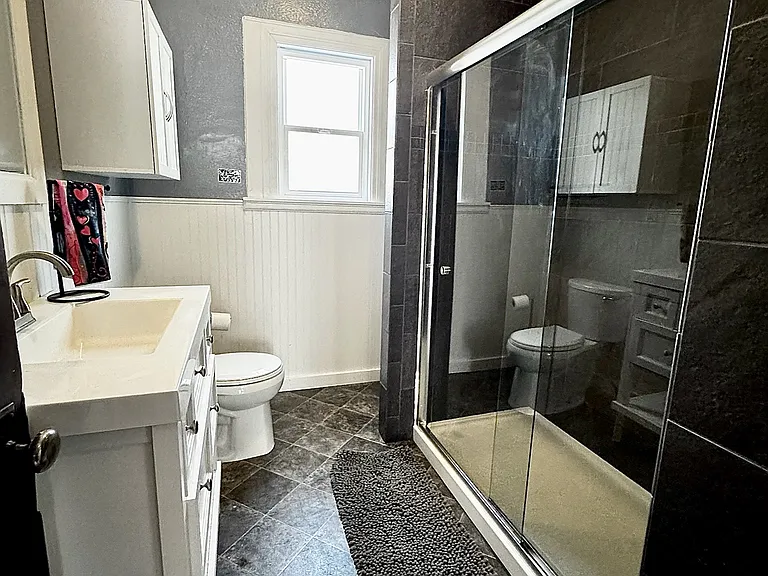 Beautifully renovated bathroom with large shower.