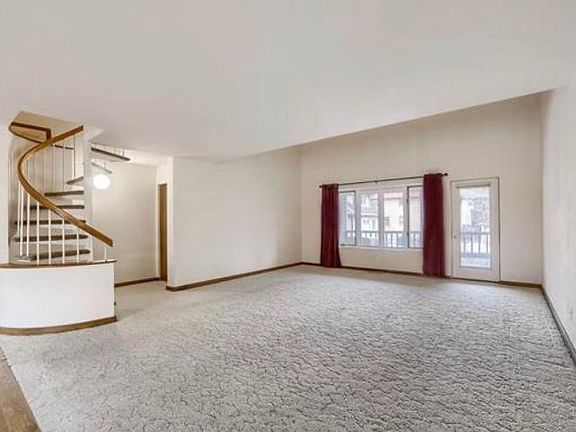 Spacious living room with private deck entrance.