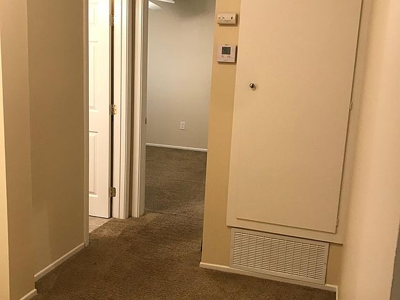 Landing upstairs leads to two bedrooms and full bathroom