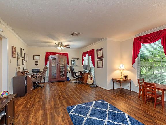 This is the formal dining room and formal living room that's currently being used as an office.