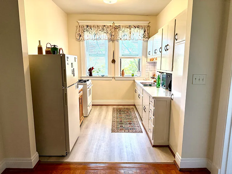 This picture and the next 10, are from the apartment 6, currently for rent. This picture was taken from the breakfast room looking into the kitchen. You'll notice the hardwood floor and new kitchen flooring.