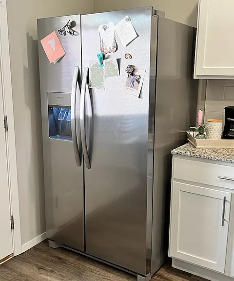 Stainless steel side-by-side refrigerator with water and ice in the door!