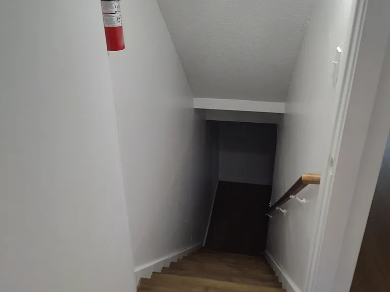 Stairs to the full finished basement and utility Room.