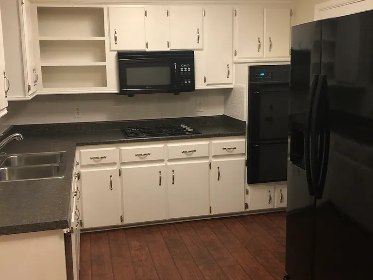 Garage entry to left of fridge