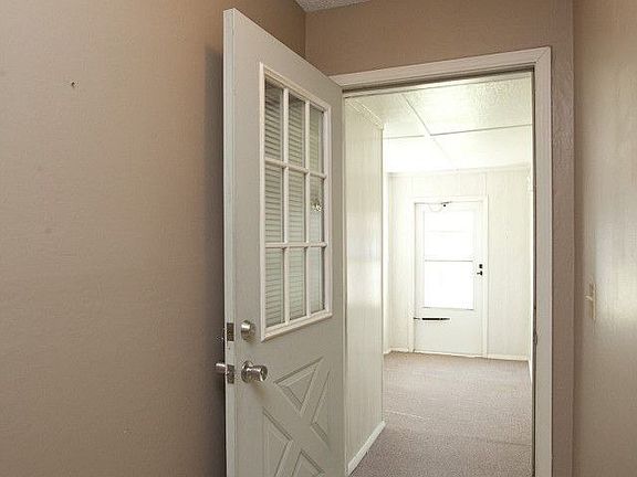 Front entry leads to covered porch