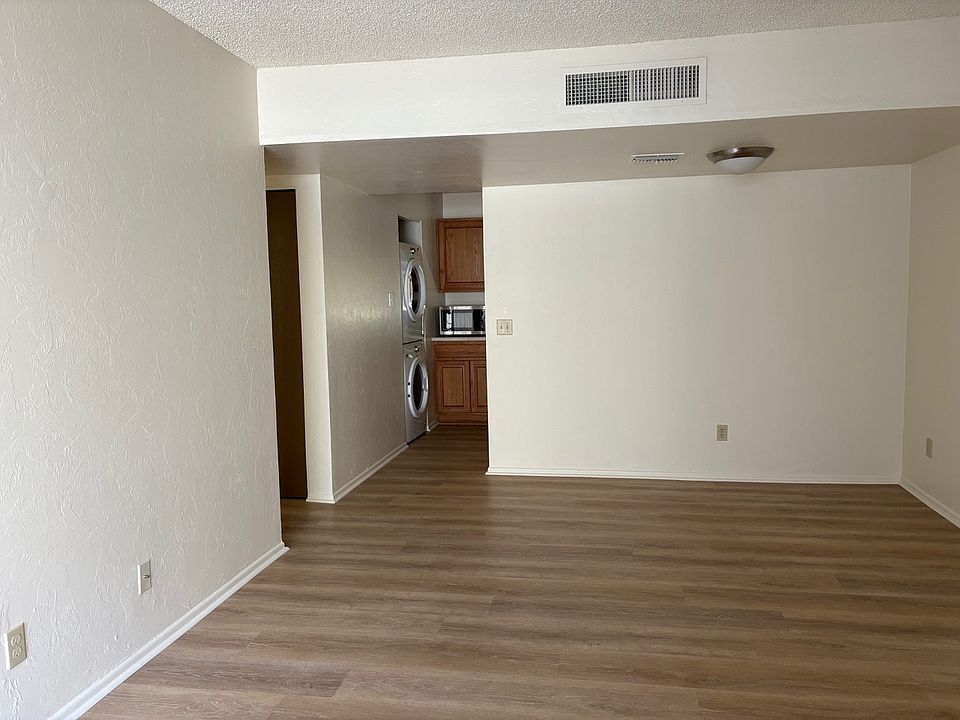 Living room, showing dining area and kitchen entry