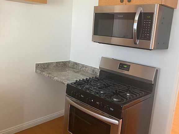 Kitchen. Brand new FRIGIDAIRE Range and Over-the-Range Microwave.