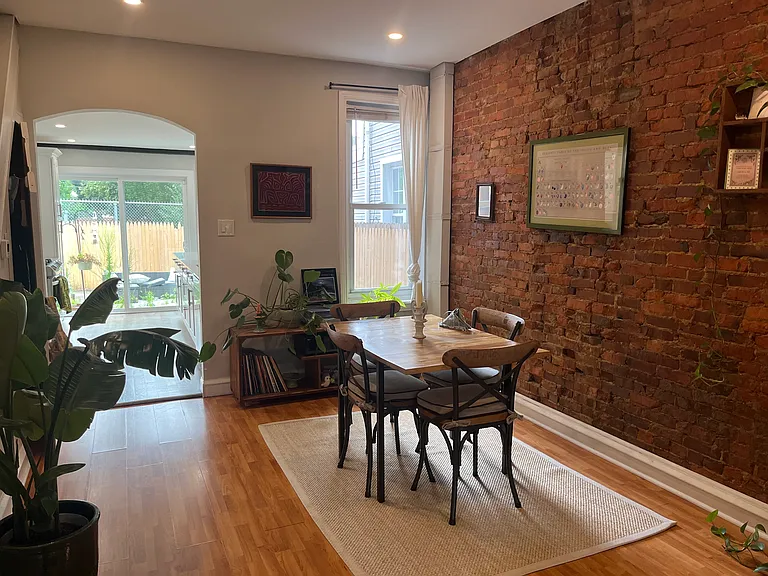 Dining room with exposed original brick
