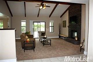 Entry way into Great Room. Slider opens up to backyard with covered patio and pool.