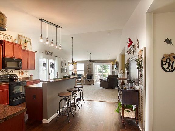 Gorgeous open floor plan with vaulted ceiling, custom cabinets, laminate wood flooring to upgraded carpet, gas fireplace, and much, much more.
