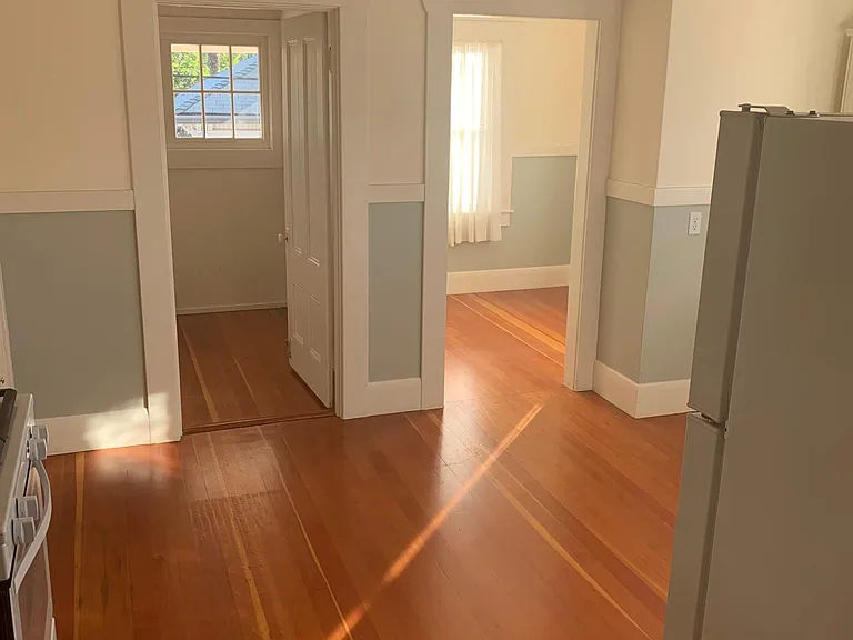 Two small rooms off the kitchen. Access to back deck.