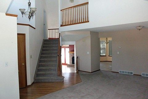 Entry View of Living Room to Upstairs