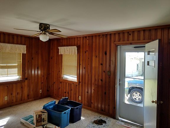 Cozy den adjacent to kitchen; kitchen pictures to be poste
