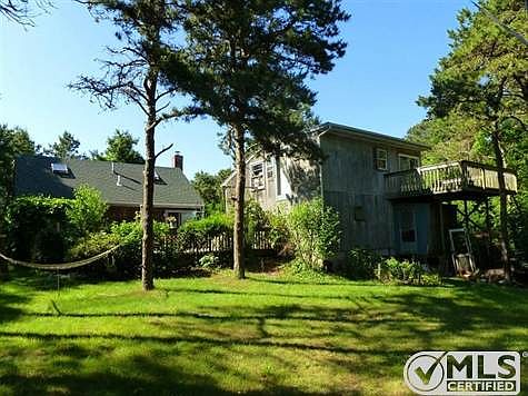 Rear view of the property showing the large garage with loft above