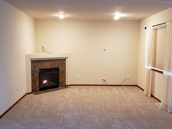 Living Room w/ Gas Fireplace and New Stain Master type carpet Thru out 1st Floor and Stairs