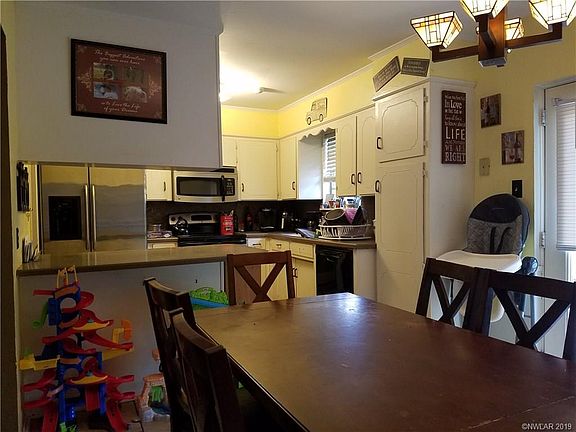 Kitchen, dinning with french doors that lead to the back yard.