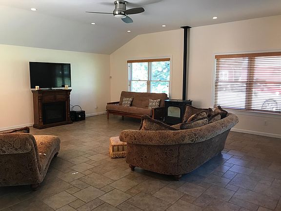 Family Room with Radiant Ceramic Tile Floor and Pellet Stove
