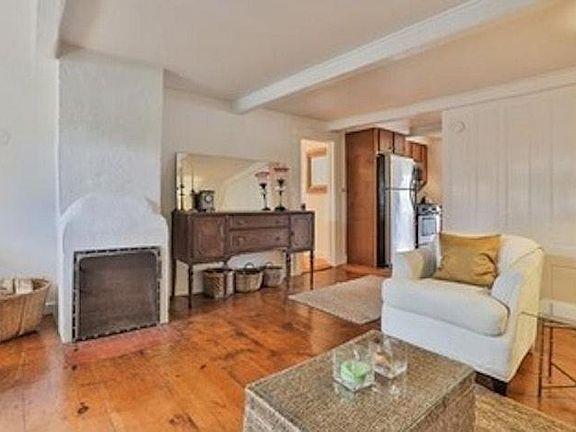 Living Room with Wood Burning Fireplace