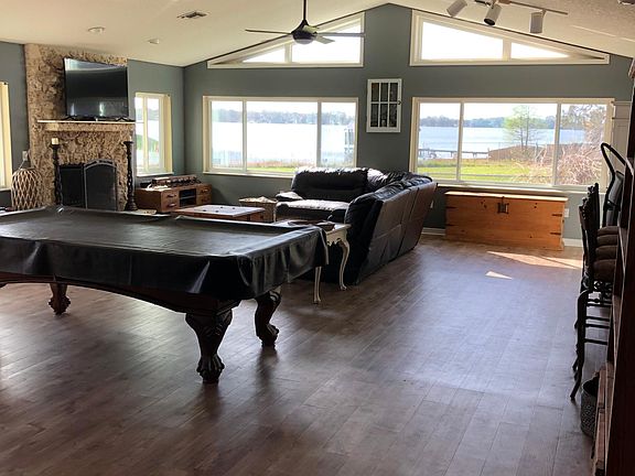Large Family room with FP facing the lake. Beautiful panoramic views of lake Joanna