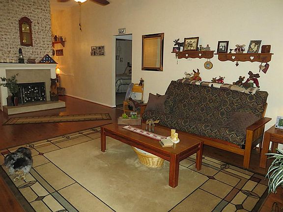 Living Room has gas log fireplaceHOme is well cared for. Updated laminate wood floors.