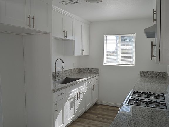 Kitchen with newer cabinets, countertops