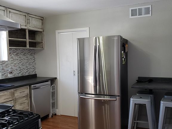 Kitchen with additional counter space, Black granite sink and automatic faucet not shown in picture