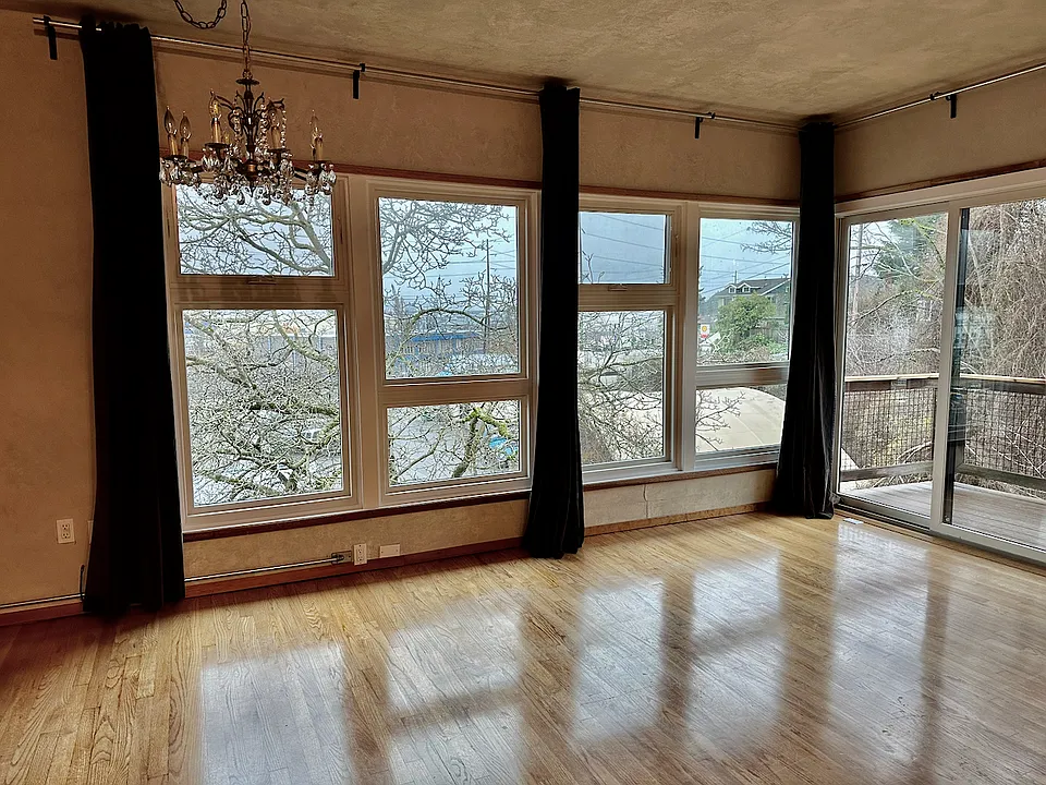 Winter view from living room toward the Olympic Mountains and Ballard Bridge.