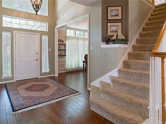 As you enter this home the formal dining room is the room that you see on the right, with windows looking out on the front yard.  Engineered hardwood floors.