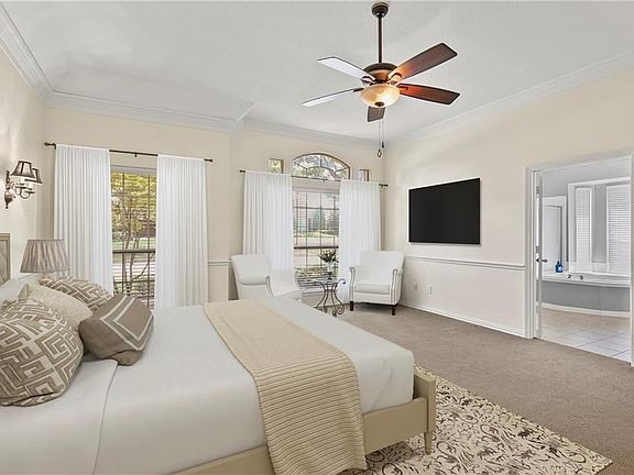 This room is virtually staged. Mounted TV is not included in the purchase of this home.