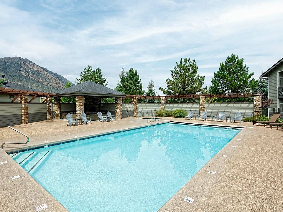 Relax by the pool with stunning mountain views, offering a perfect blend of tranquility and comfort.