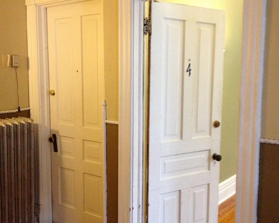 door into apartment from upstairs common landing
