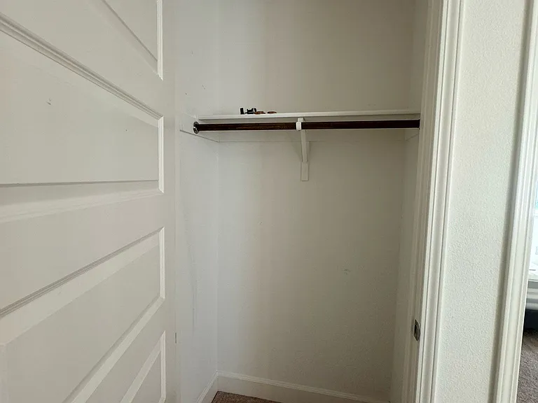 Closet inside next to garage to hang clothes on first floor