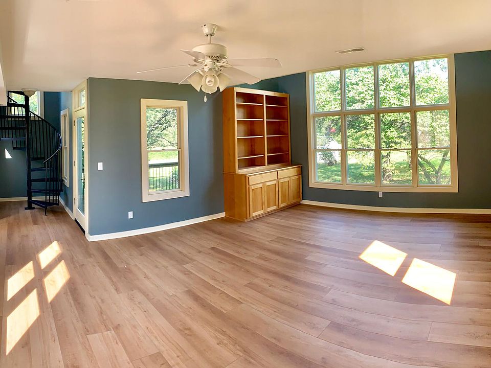 Lower Level of Tower Addition with Built-in Bookshelf. 360 Windows