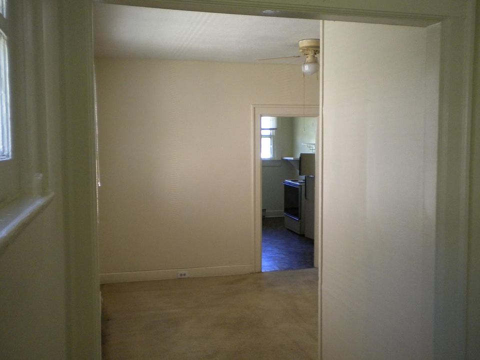 From front door thru living room thru middle room to kitchen.