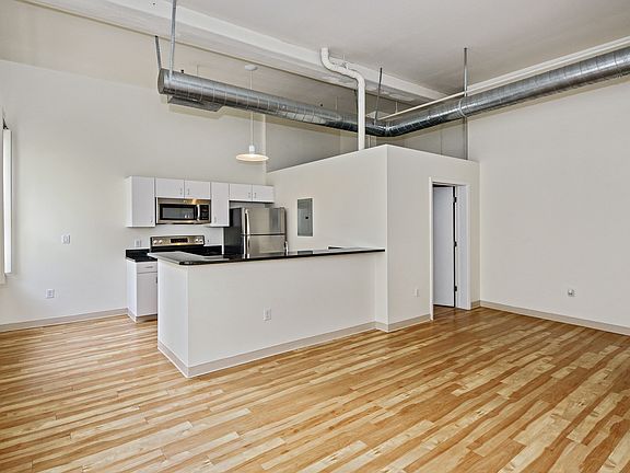 Kitchen features granite countertops, stainless steel appliances and breakfast bar