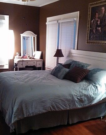 Bedroom : Painted chocolate brown. Hardwood floors