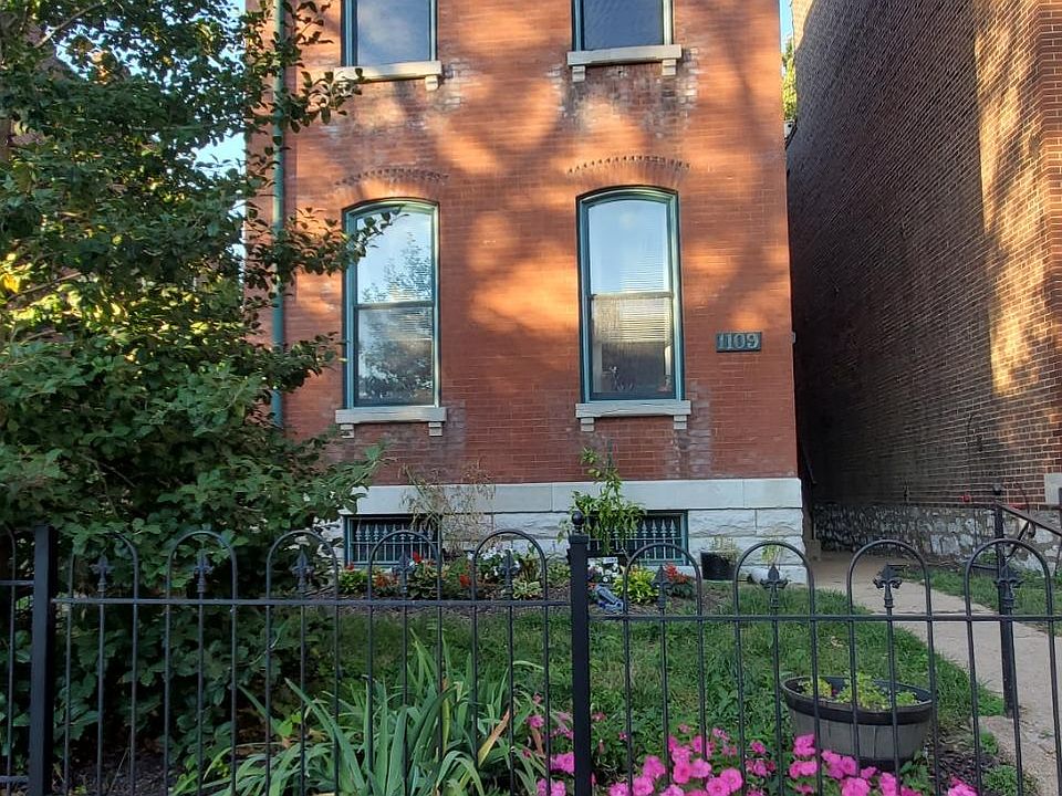 A classic Soulard brick home with plenty of outdoor space.