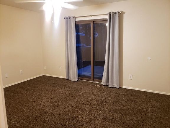 Upstairs Master bedroom with sliding glass door to above ground patio